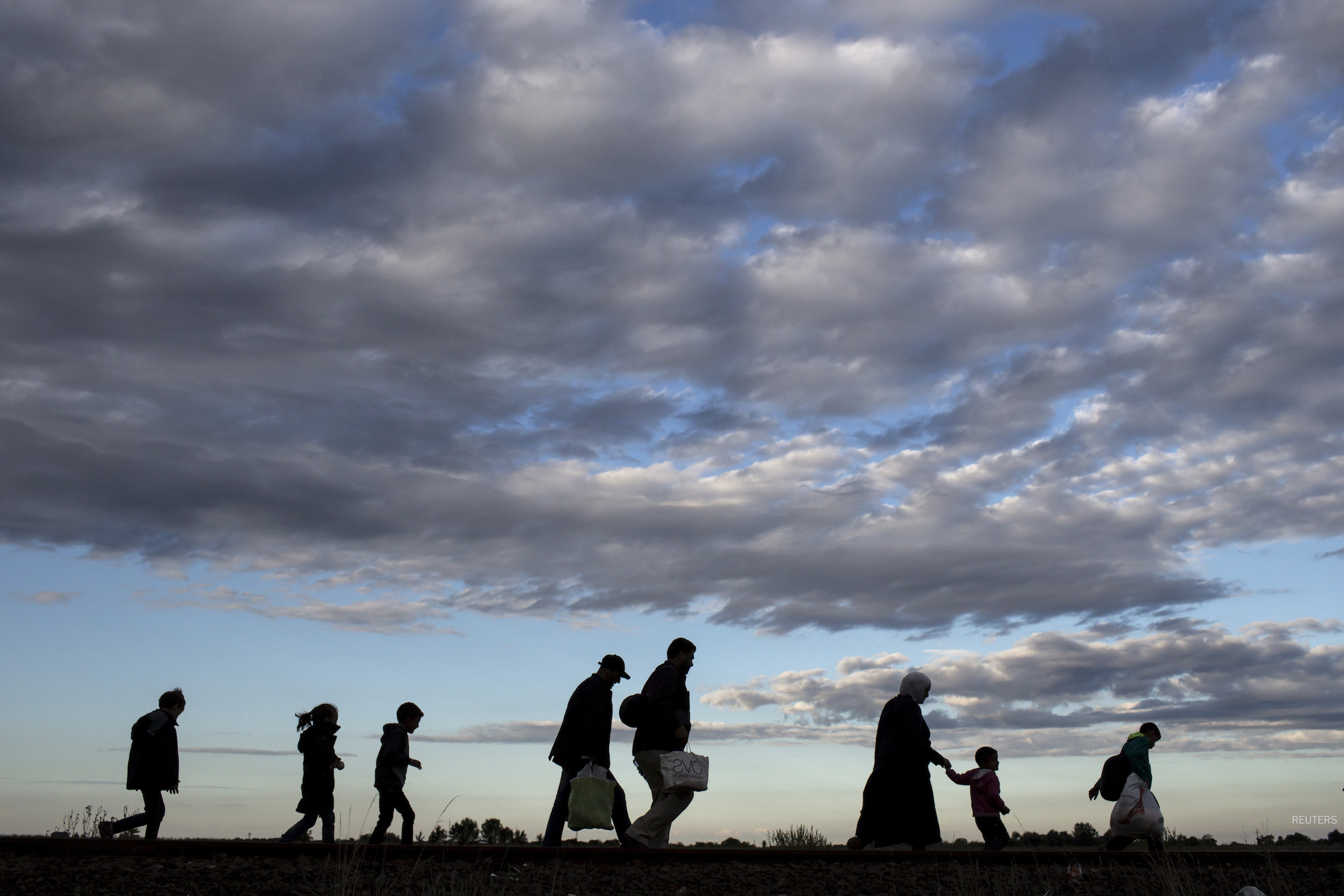 refugees walking
